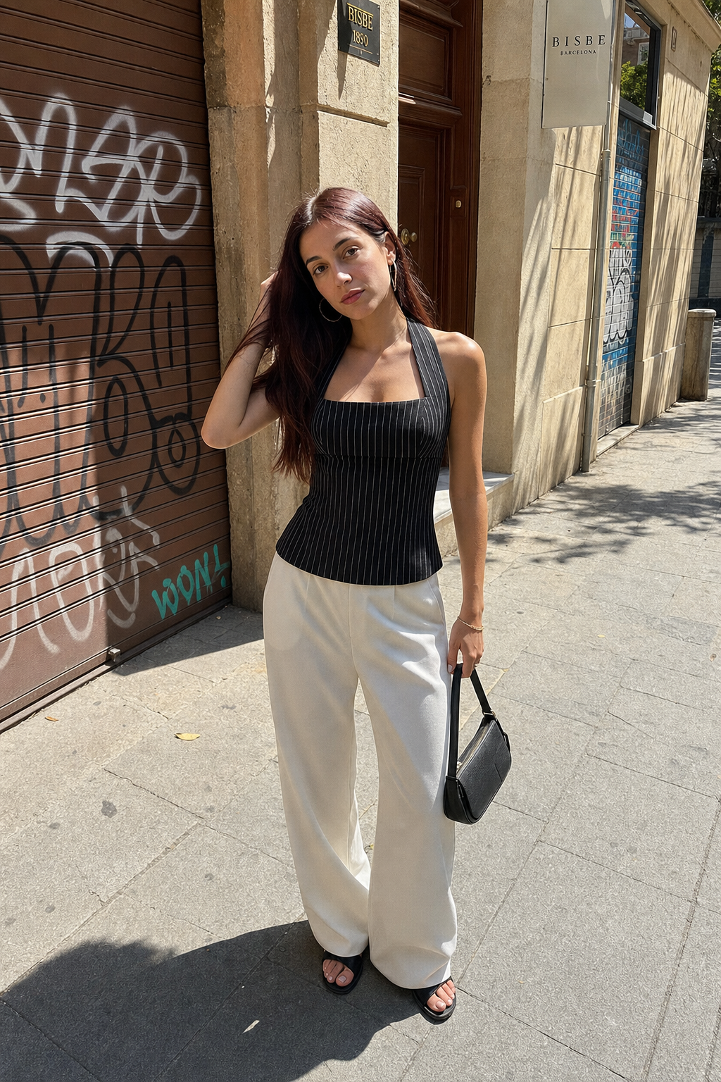 Elara Voss Structured Pinstripe Black Top on model 1